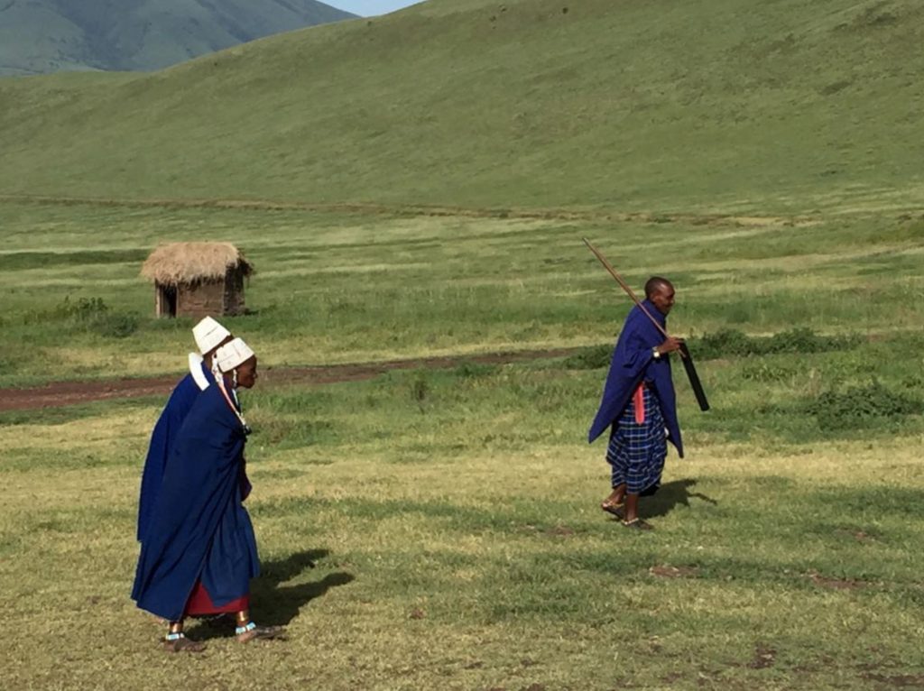 Maasai walking on the side of the road